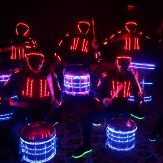 drummers in LED costumes